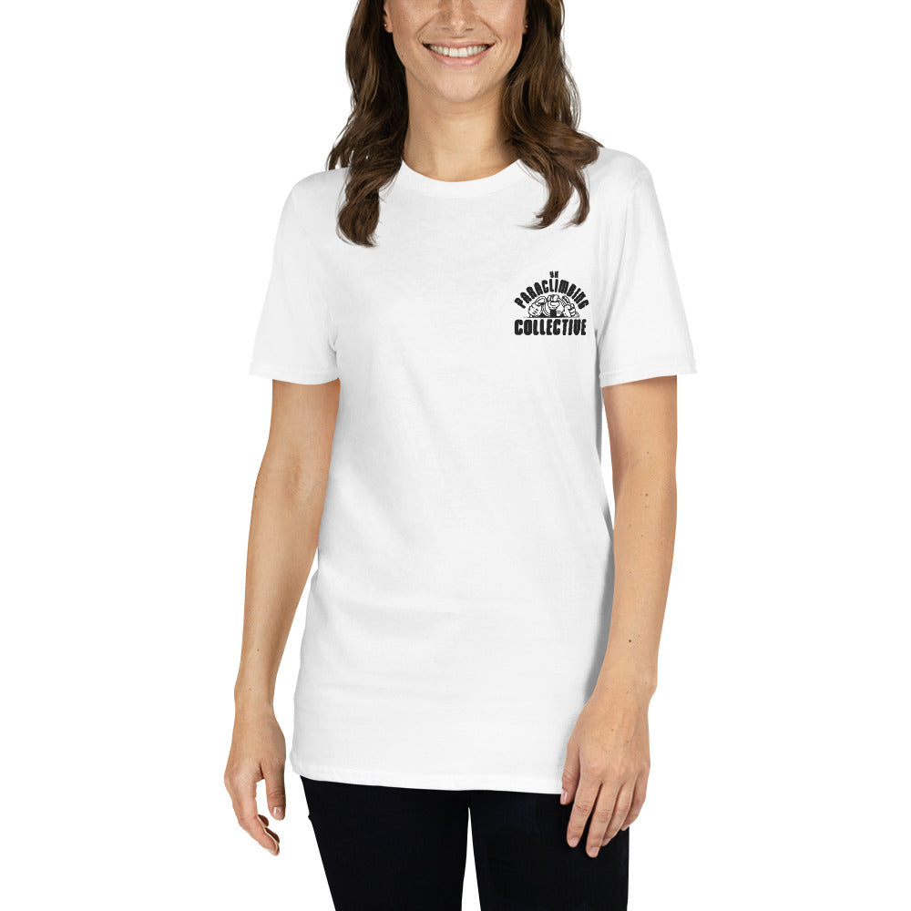 A white t-shirt with the black UK Paraclimbing Collective logo on the left breast. The logo is "UK paraclimbing collective" with hands holding climbing ropes and quickdraws