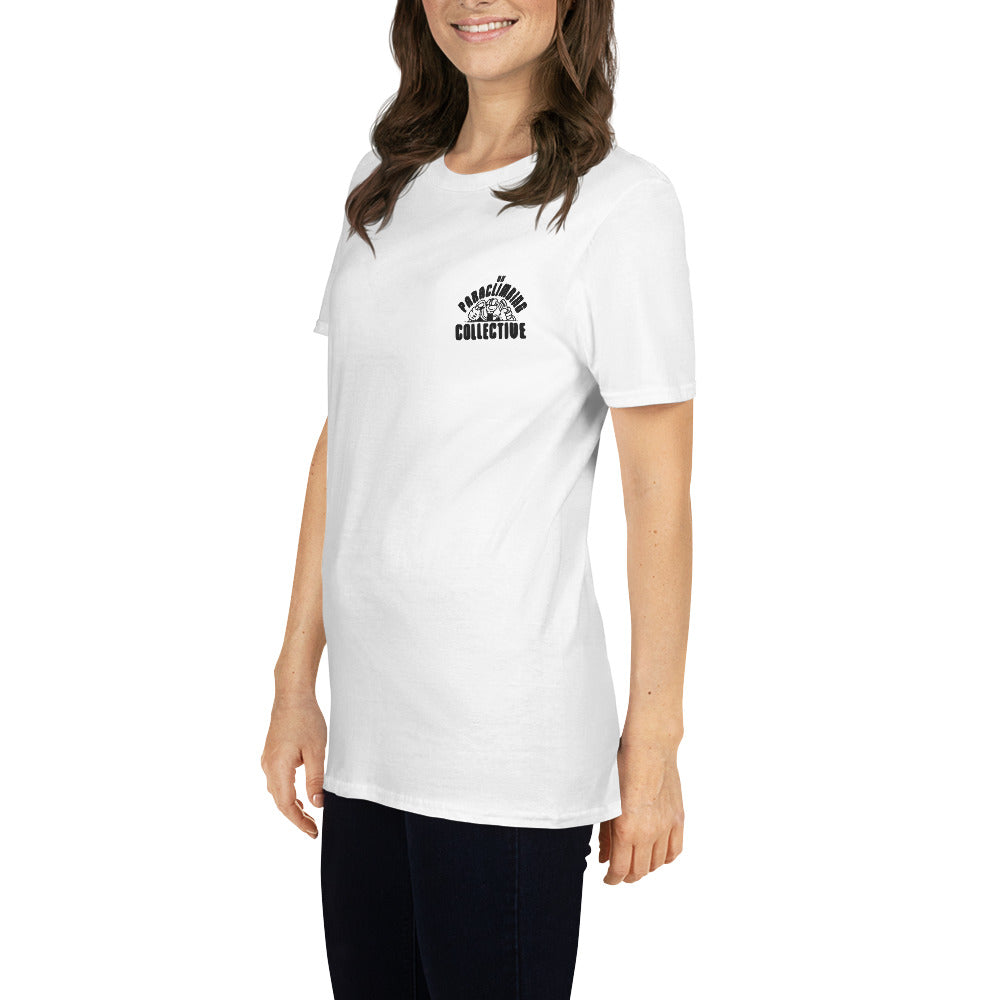 A white t-shirt with the black UK Paraclimbing Collective logo on the left breast. The logo is "UK paraclimbing collective" with hands holding climbing ropes and quickdraws